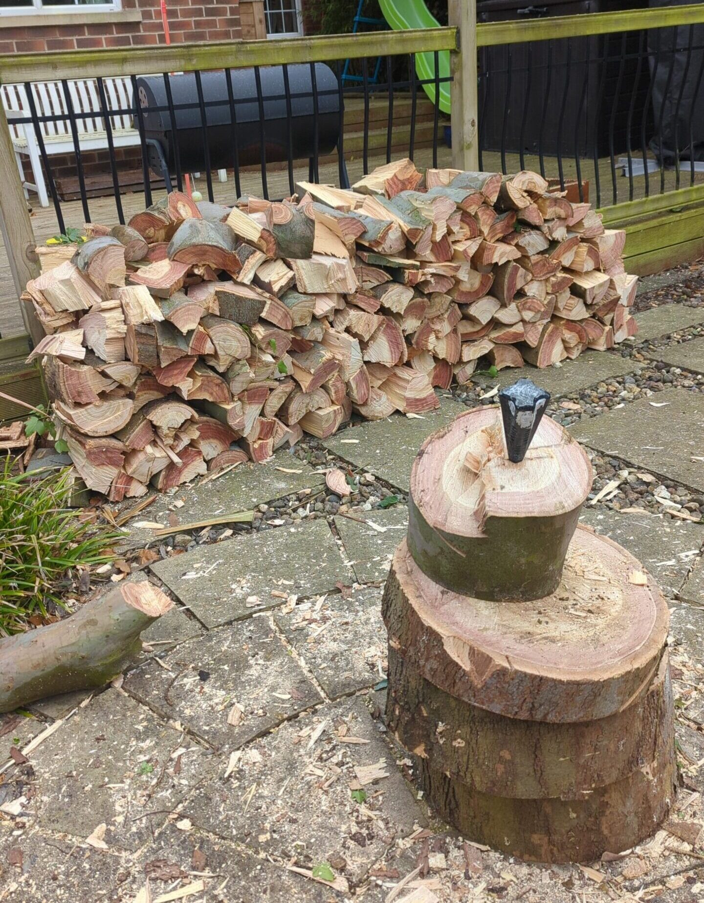 Using a log splitting wedge/ grenade on twisted Eucalyptus rounds North Shields