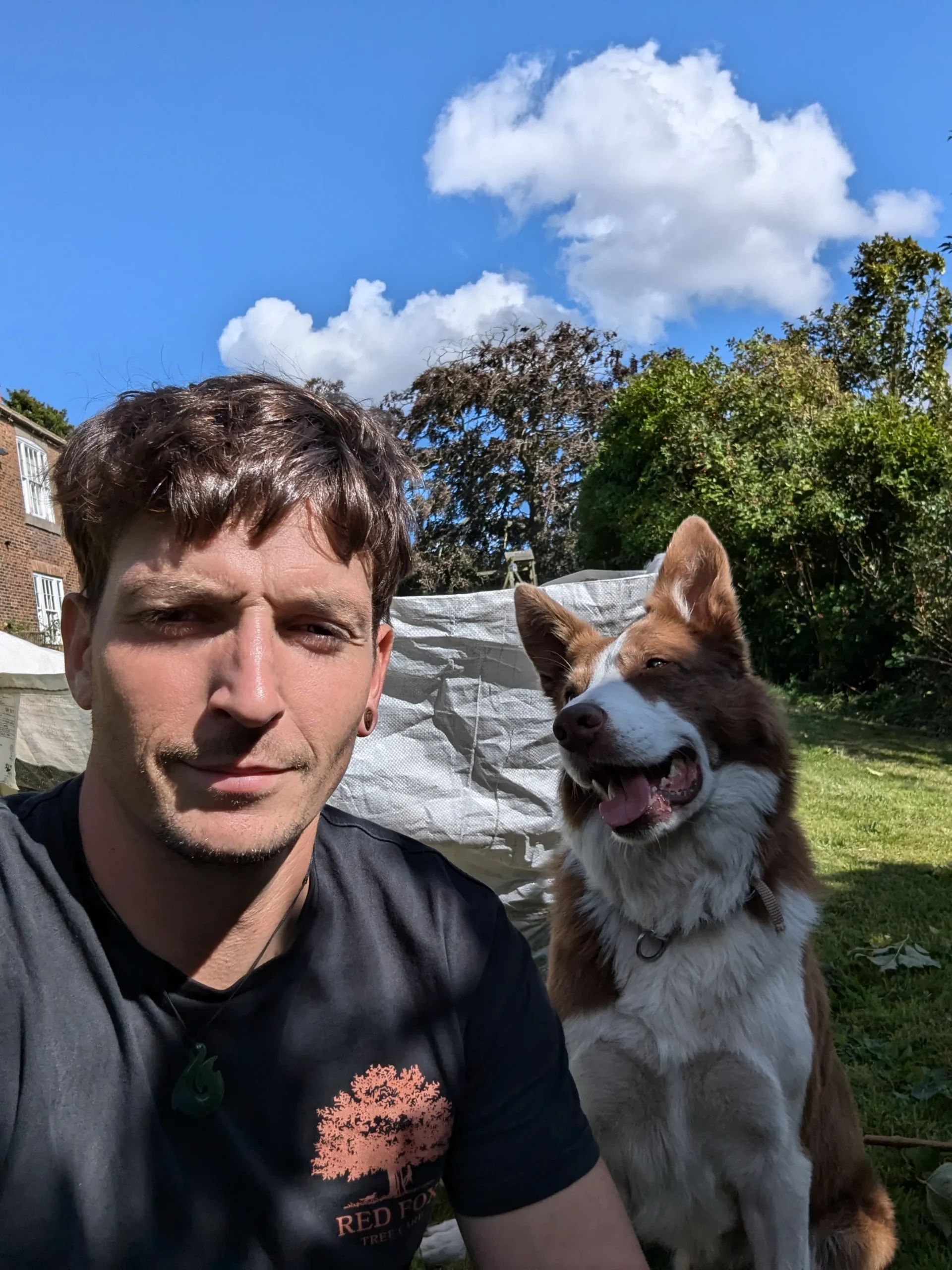 Red Fox Tree Care team member with Max during a day of professional tree care