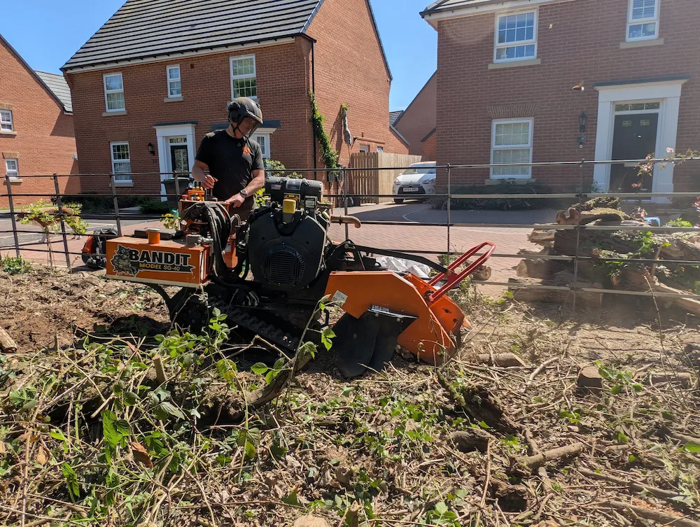 Stump grinding services using a tracked stump grinder to remove large tree stumps during site preparation in the North East.